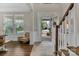 Inviting foyer with hardwood floors, staircase, ample natural light, and a view of the front porch at 1230 Therns Ferry Dr, Fort Mill, SC 29708