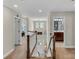 Upstairs hallway view with access to bedrooms and bathrooms. Natural light and neutral color palette at 1230 Therns Ferry Dr, Fort Mill, SC 29708