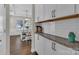 Kitchen view featuring white cabinets, granite countertops, subway tile backsplash, and open view of the dining room at 1230 Therns Ferry Dr, Fort Mill, SC 29708