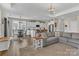 Spacious open-concept living space with a dining area, kitchen, and comfortable seating area. Hardwood floors at 1230 Therns Ferry Dr, Fort Mill, SC 29708