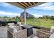 Relaxing patio with seating area, outdoor grill, and a view of the backyard at 1230 Therns Ferry Dr, Fort Mill, SC 29708