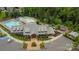 Aerial view of the community pool with modern clubhouse, splash pad, and lounge chairs at 1230 Therns Ferry Dr, Fort Mill, SC 29708