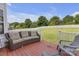 Cozy back deck with cushioned seating, ideal for outdoor relaxation with a well-maintained backyard view at 12303 Shadow Ridge Ln, Charlotte, NC 28273