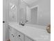 Bathroom featuring a long, white vanity with double mirrors, and bright neutral paint at 12303 Shadow Ridge Ln, Charlotte, NC 28273