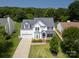 Charming two-story home with a well-manicured lawn, bay window and inviting porch at 12303 Shadow Ridge Ln, Charlotte, NC 28273