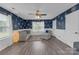 Living room with stylish decor, featuring hardwood floors and patterned wallpaper at 12303 Shadow Ridge Ln, Charlotte, NC 28273