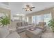 Inviting living room with neutral decor, comfortable seating, and abundant natural light at 12303 Shadow Ridge Ln, Charlotte, NC 28273