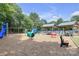 Community playground featuring slides, swings, and shaded picnic areas for residents' enjoyment at 12303 Shadow Ridge Ln, Charlotte, NC 28273