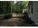 View of a new backyard deck with wood railings and a few steps down to the lawn at 1250 Hampton Grace Ave, Lancaster, SC 29720