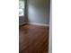 Bright bedroom features hardwood floors, ample natural light, and neutral wall color at 1250 Hampton Grace Ave, Lancaster, SC 29720