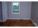 Cozy bedroom with hardwood floors and a bright window providing natural light at 1250 Hampton Grace Ave, Lancaster, SC 29720