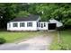 Charming single-story home with white siding, black shutters, and an attached one-car carport at 1250 Hampton Grace Ave, Lancaster, SC 29720