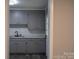 Gray kitchen featuring gray cabinets, white subway tiles, and a modern faucet at 1250 Hampton Grace Ave, Lancaster, SC 29720
