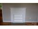 Living room with a decorative white brick fireplace and built-in shelving at 1250 Hampton Grace Ave, Lancaster, SC 29720