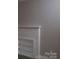 Stylish white brick wall feature offers ample shelving and complements the neutral decor at 1250 Hampton Grace Ave, Lancaster, SC 29720