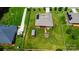 Birds-eye view of home with spacious backyard, storage shed, and partial fencing, perfect for outdoor living at 141 Tall Fern Loop, Mooresville, NC 28117