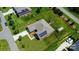 Expansive aerial view of a well-manicured home with solar panels, a shed, a pergola, and a fenced backyard at 141 Tall Fern Loop, Mooresville, NC 28117