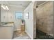 Bathroom features granite countertops, tiled floors, and a walk-in shower at 141 Tall Fern Loop, Mooresville, NC 28117