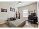 Bedroom featuring a ceiling fan, neutral paint colors, and an office area at 141 Tall Fern Loop, Mooresville, NC 28117