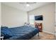 Bedroom features a ceiling fan, neutral paint colors, and a mounted television at 141 Tall Fern Loop, Mooresville, NC 28117