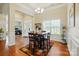 Dining room features hardwood floors, chandelier, and large window, perfect for Gathering gatherings at 141 Tall Fern Loop, Mooresville, NC 28117