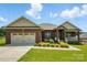 Charming brick home with a manicured lawn and inviting front porch, great curb appeal at 141 Tall Fern Loop, Mooresville, NC 28117