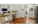 Modern kitchen features granite counters, stainless steel appliances, and white cabinets at 141 Tall Fern Loop, Mooresville, NC 28117