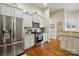 Modern kitchen with stainless steel fridge, gas range, and white cabinetry at 141 Tall Fern Loop, Mooresville, NC 28117