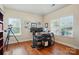 Bright home office with hardwood floors and ample natural light from two large windows at 141 Tall Fern Loop, Mooresville, NC 28117