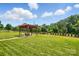 Backyard pergola with outdoor seating creates a relaxing retreat for enjoying nature and outdoor entertaining at 141 Tall Fern Loop, Mooresville, NC 28117