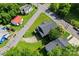 An aerial view of the property shows its position on a corner lot, surrounded by trees and other houses at 146 Georgia Sw St, Concord, NC 28025