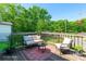 Relaxing outdoor deck with comfortable seating, perfect for enjoying nature at 146 Georgia Sw St, Concord, NC 28025