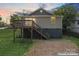 Cozy home featuring a charming deck and a spacious gravel area with lush green grass at 146 Georgia Sw St, Concord, NC 28025
