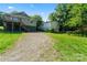 Inviting backyard with gravel driveway, perfect for extra parking and outdoor activities at 146 Georgia Sw St, Concord, NC 28025