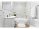 Clean bathroom with tiled shower/tub, white vanity and ample lighting at 146 Georgia Sw St, Concord, NC 28025