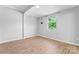 Comfortable bedroom with natural lighting through a window, neutral walls, and plenty of space at 146 Georgia Sw St, Concord, NC 28025