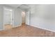 Spacious bedroom with an en-suite bathroom featuring a glass shower and a barn door at 146 Georgia Sw St, Concord, NC 28025