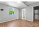 Bright bedroom with a window and an ensuite with a washer and dryer at 146 Georgia Sw St, Concord, NC 28025