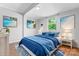 Cozy bedroom with coastal decor, bright blue accents, and natural light from a large window at 146 Georgia Sw St, Concord, NC 28025