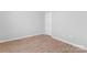 Empty bedroom showcasing light hardwood floors and neutral walls at 146 Georgia Sw St, Concord, NC 28025