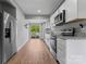 Modern kitchen with stainless steel appliances, granite countertops, and bright white cabinetry at 146 Georgia Sw St, Concord, NC 28025