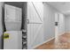 Laundry area features stacked washer and dryer and a white sliding door at 146 Georgia Sw St, Concord, NC 28025