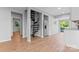 Open concept living room featuring stainless steel appliances and a spiral staircase at 146 Georgia Sw St, Concord, NC 28025