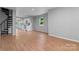 Inviting living area with wood-look flooring and an open layout to the kitchen at 146 Georgia Sw St, Concord, NC 28025