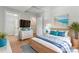 Tranquil bedroom featuring a wicker bed frame and en-suite bath with tile shower at 146 Georgia Sw St, Concord, NC 28025