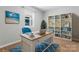 Home office with large window, built-in shelving and natural light at 146 Georgia Sw St, Concord, NC 28025