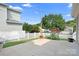 A charming backyard featuring a concrete patio and a white picket fence at 14923 Almondell Dr, Huntersville, NC 28078