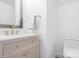 Chic powder room features a modern vanity with gold fixtures at 14923 Almondell Dr, Huntersville, NC 28078