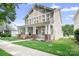 Charming two-story home featuring a welcoming front porch and well-manicured lawn at 14923 Almondell Dr, Huntersville, NC 28078