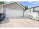 A spacious two-car garage featuring a white door with an extended driveway at 14923 Almondell Dr, Huntersville, NC 28078